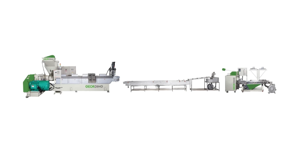 Full panorama of a GEORDING industrial PET bottle recycling production line featuring silos control panels and extrusion systems