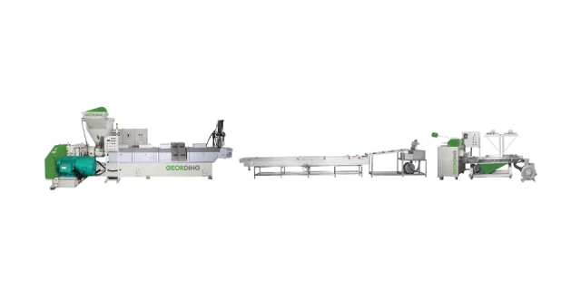 Full panorama of a GEORDING industrial PET bottle recycling production line featuring silos control panels and extrusion systems