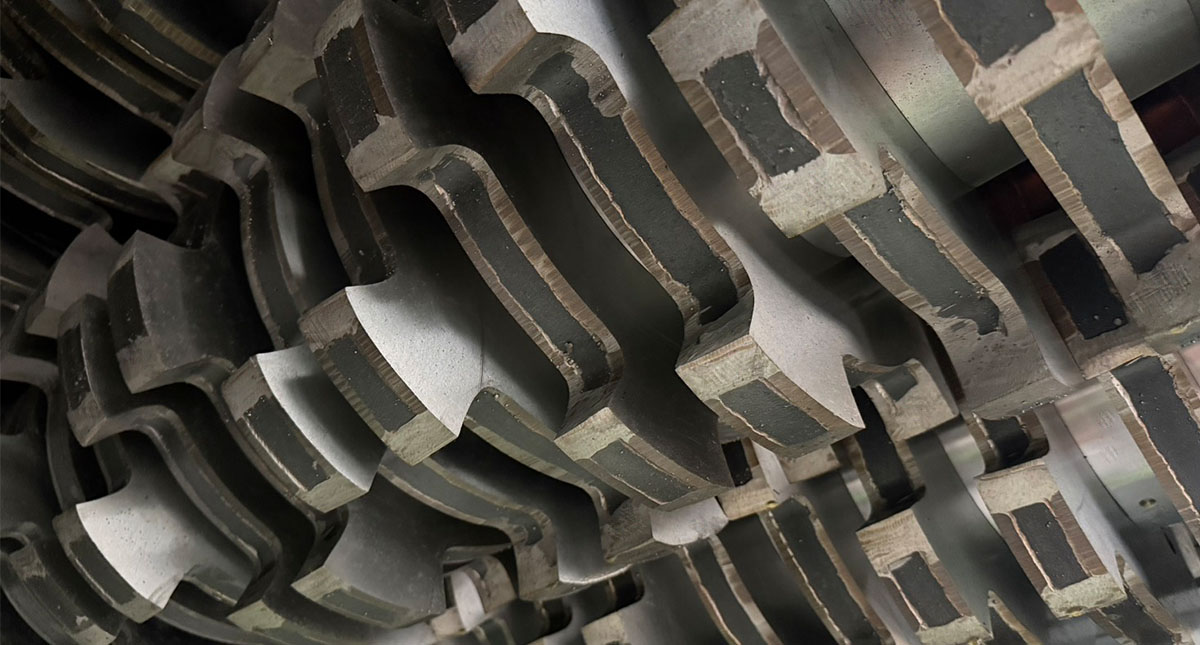 Modular cutter blade assembly. Each blade is an independent, swappable unit — operators replace only worn blades rather than rebuilding the rotor stack, and the same modular logic supports stacked configurations for scaled-up throughput.